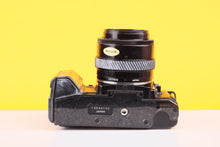 Load image into Gallery viewer, Minolta 7000 AF 35mm Film SLR Camera with Minolta AF 35–70mm f/4 Macro Zoom Lens

