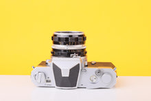 Load image into Gallery viewer, Nikon Nikomat FT 35mm Film SLR Camera with Nikkor-H Auto 50mm f/2 Lens
