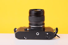 Load image into Gallery viewer, Yashica FX-1 Electro 35mm Film SLR Camera with Yashica ML Zoom 42–75mm f/3.5–4.5 Lens
