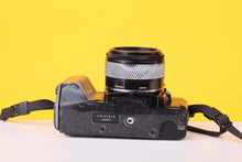 Load image into Gallery viewer, Minolta 5000 AF 35mm Film SLR Camera with Minolta AF 50mm f/1.7 Lens
