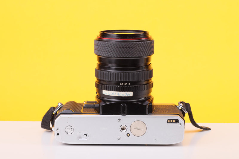 Minolta X-300 35mm Film SLR Camera with Tokina SD 28–70mm f/3.5–4.5 Zoom Lens