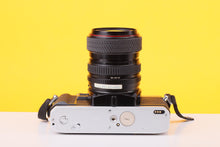 Load image into Gallery viewer, Minolta X-300 35mm Film SLR Camera with Tokina SD 28–70mm f/3.5–4.5 Zoom Lens
