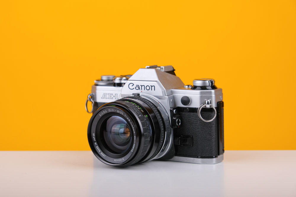Canon AE-1 Silver 35mm SLR Film Camera with Sigma Mini-Wide 28mm f2.8 Lens