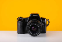 Load image into Gallery viewer, Canon EOS 1000F 35mm SLR Film Camera with Sigma 28-70mm f/3.5 Lens
