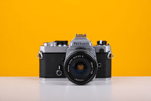 Load image into Gallery viewer, Nikon FM 35mm Film Camera with Nikon 28mm f/2.8 Lens
