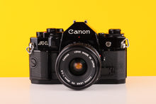 Load image into Gallery viewer, Canon A-1 35mm SLR Film Camera with Canon 28mm f2.8 
