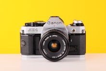 Load image into Gallery viewer, Canon AE-1 Program 35mm Film Camera with Canon FD 28mm f/2.8
