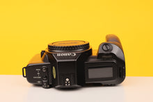 Load image into Gallery viewer, Camera body with &#39;Canon&#39; branding on a yellow background
