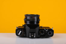 Load image into Gallery viewer, Chinon CE Emotrom 35mm film Camera with 50mm f/2.8 Carl Zeiss Lens
