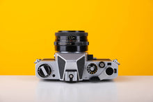 Load image into Gallery viewer, Chinon CS 35mm SLR Film Camera with 50mm f2.8 Carl Zeiss Lens
