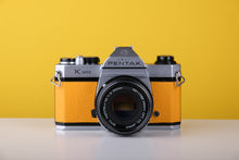 Load image into Gallery viewer, Pentax K1000 35mm Film Camera with Pentax 50mm f/2 Lens in Yellow
