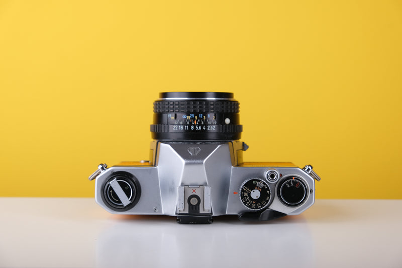 Pentax K1000 35mm Film Camera with Pentax 50mm f/2 Lens in Yellow