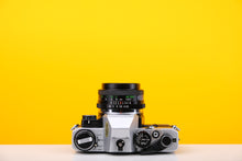Load image into Gallery viewer, Olympus OM10 Vintage 35mm SLR Film Camera with Vivitar 28mm Lens and Manual Adaptor

