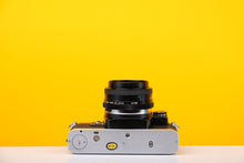 Load image into Gallery viewer, Olympus OM10 Vintage 35mm SLR Film Camera with Vivitar 28mm Lens and Manual Adaptor
