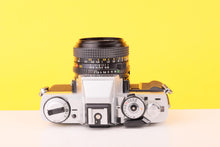 Load image into Gallery viewer, Minolta XG-M 35mm SLR Film Camera with Minolta MD Rokkor 50mm f1.7 Lens
