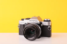 Load image into Gallery viewer, Olympus OM20 35mm SLR Film Camera with Zuiko 50mm f3.5 Lens
