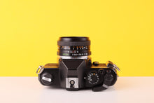Load image into Gallery viewer, Yashica FX-3 Super 2000 35mm Film Camera with Yashica 50mm f/2 Lens
