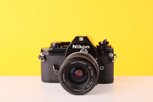 Load image into Gallery viewer, Nikon EM 35mm Film Camera with Nikon 35-70mm f/3.5 Lens
