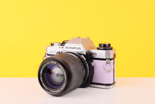 Load image into Gallery viewer, Olympus OM10 35mm SLR Film Camera with Zoom LENS 35-70mm f3.5 Lens in Lilac
