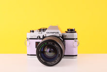 Load image into Gallery viewer, Olympus OM10 35mm SLR Film Camera with Zoom LENS 35-70mm f3.5 Lens in Lilac
