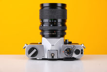 Load image into Gallery viewer, Fujica ST605n SLR 35mm Film Camera with Cosina 28-70mm f/4 Macro Lens
