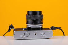 Load image into Gallery viewer, Minolta SrT101b 35mm Film Camera with Minolta 50mm f1.4 Lens
