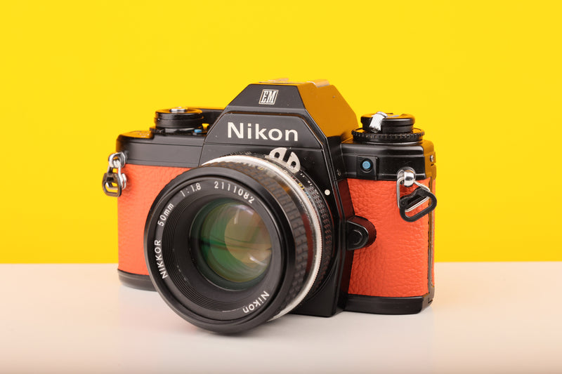 Nikon Em camera with orange body