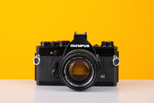 Load image into Gallery viewer, Olympus OM-1n MD Black 35mm Film Camera with Zuiko 50mm f/1.4 Lens
