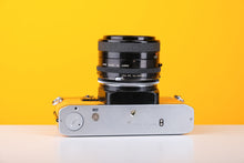Load image into Gallery viewer, Olympus OM10 35mm SLR Film Camera in Yellow with Tamron 28mm f/2.8 Prime Lens

