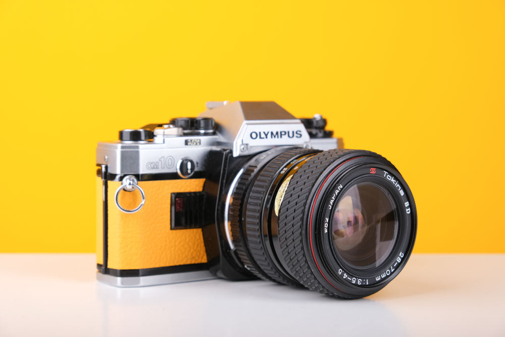 Olympus OM10 35mm SLR Film Camera in Yellow with Tokina 28-70mm f/3.5-4.5 Zoom Lens