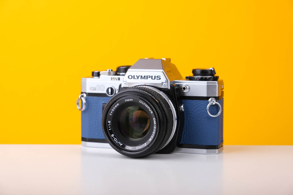 Olympus OM10 SLR Vintage 35mm Film Camera with Zuiko 50mm f/1.8 Prime Lens Reconditioned With New Blue Leather Skin