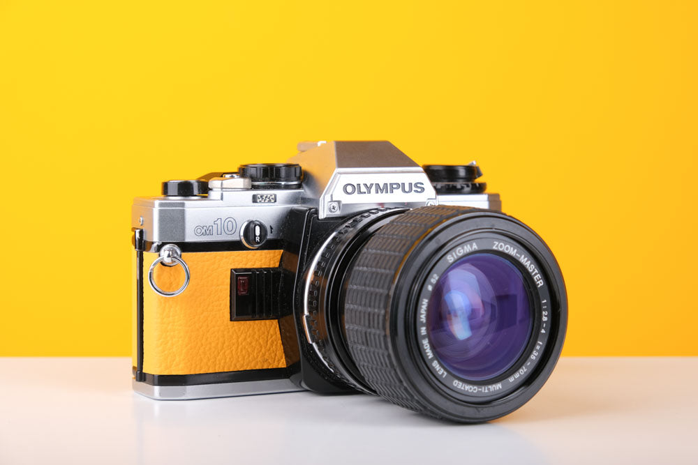 Olympus OM10 35mm SLR Film Camera in Yellow with Sigma 35-70mm f/2.8 Zoom Lens