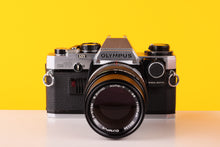 Load image into Gallery viewer, Olympus OM-10 35mm SLR Film Camera with Manual Adapter and Olympus OM-System E.Zuiko Auto-T 135mm f3.5 
