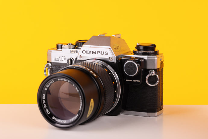 Olympus OM-10 35mm SLR Film Camera with Manual Adapter and Olympus OM-System E.Zuiko Auto-T 135mm f3.5 Lens