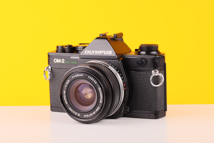 
Olympus OM-2 Spot/Program 35mm Film Camera with Olympus 28mm f3.5 Prime Lens
