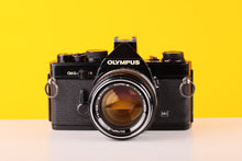 Load image into Gallery viewer, Olympus OM-2n MD Black 35mm Film Camera with Zuiko 50mm f/1.4 Lens
