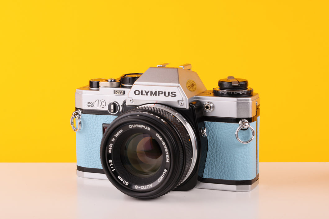 Olympus OM10 35mm Film Camera with Olympus Auto-S 50mm f1.8 MC Lens in Blue