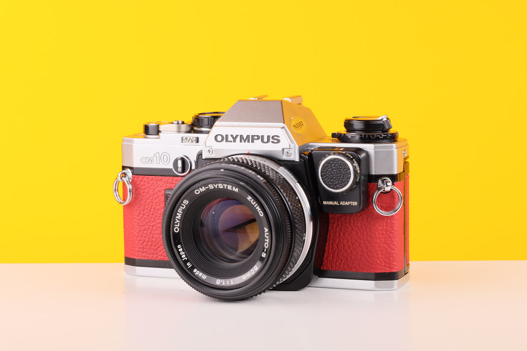 Olympus OM10 35mm Film Camera with Zuiko 50mm f1.8 Prime Lens Red Leather Skin and Manual Adapter