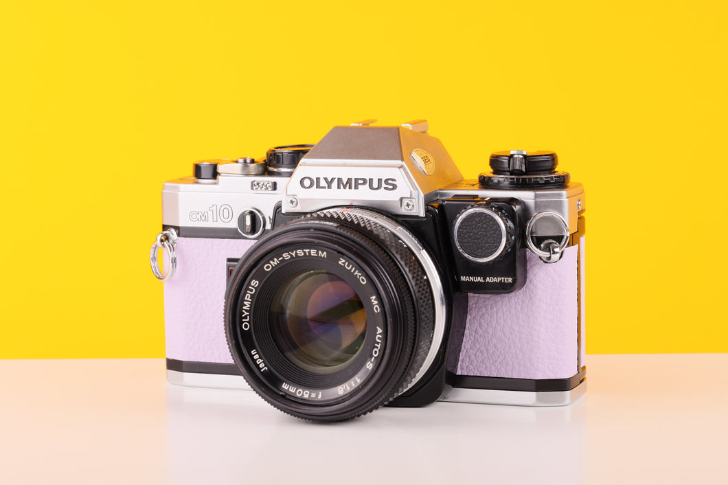 Olympus OM10 35mm SLR Film Camera with Manual Adapter and Olympus Zuiko MC Auto-S 50mm f1.8 Lens Lilac