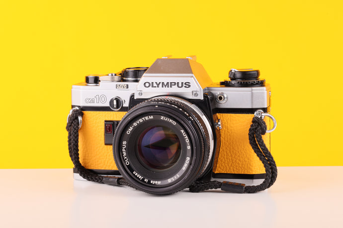 Olympus OM10 35mm SLR Film Camera with Olympus F.Zuiko Auto-S 50mm f1.8 Lens Yellow