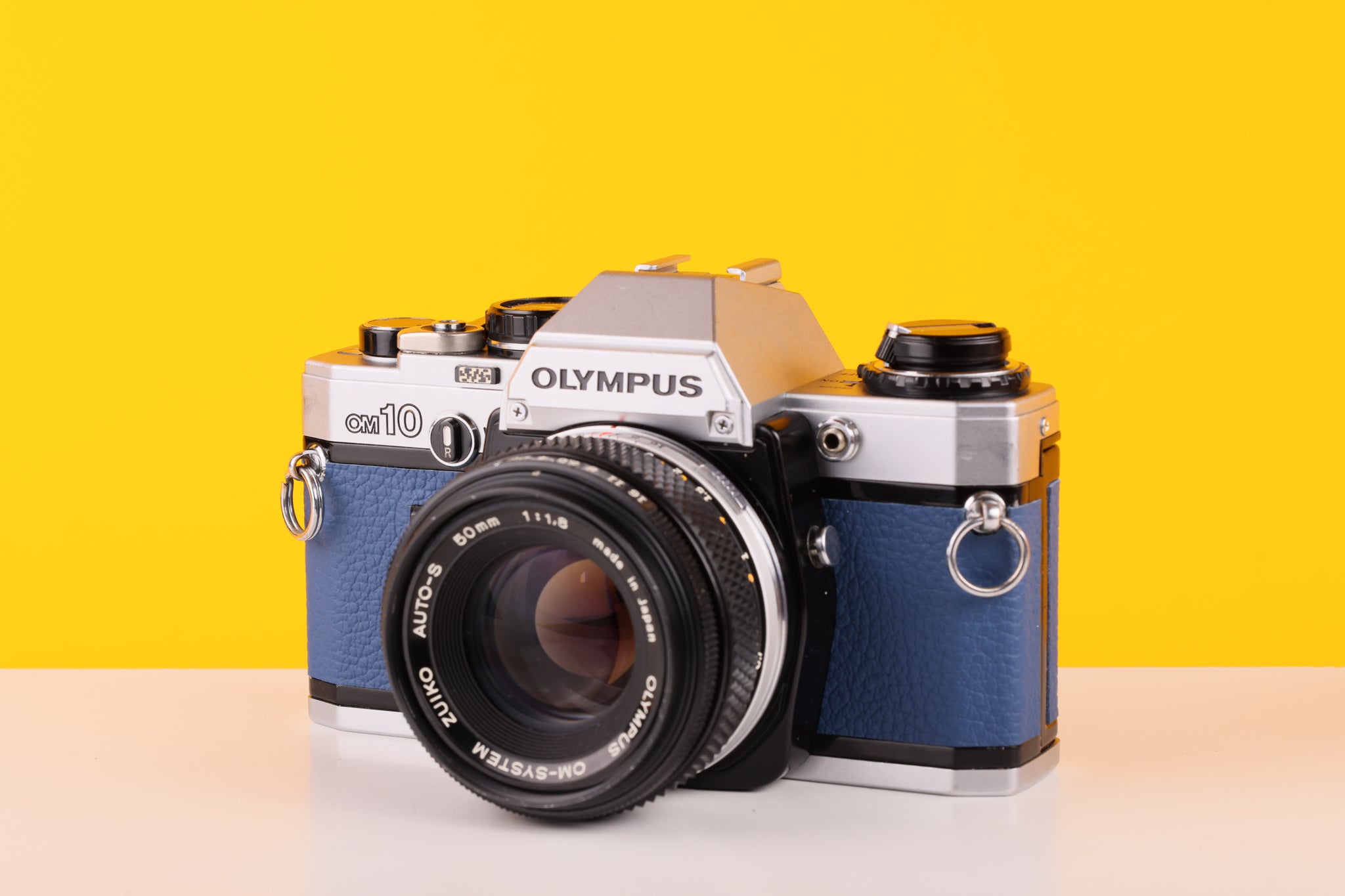 Olympus OM10 SLR Vintage 35mm Film Camera with Zuiko 50mm f/1.8 Prime Lens Reconditioned With New Blue Leather Skin