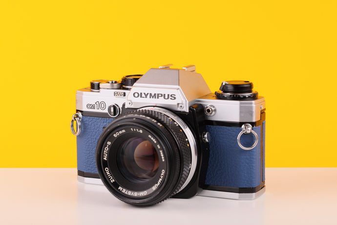 Olympus OM10 SLR Vintage 35mm Film Camera with Zuiko 50mm f/1.8 Prime Lens Reconditioned With New Blue Leather Skin