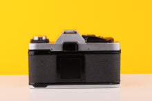 Load image into Gallery viewer, Olympus OM20 35mm SLR Film Camera with Zuiko 50mm
