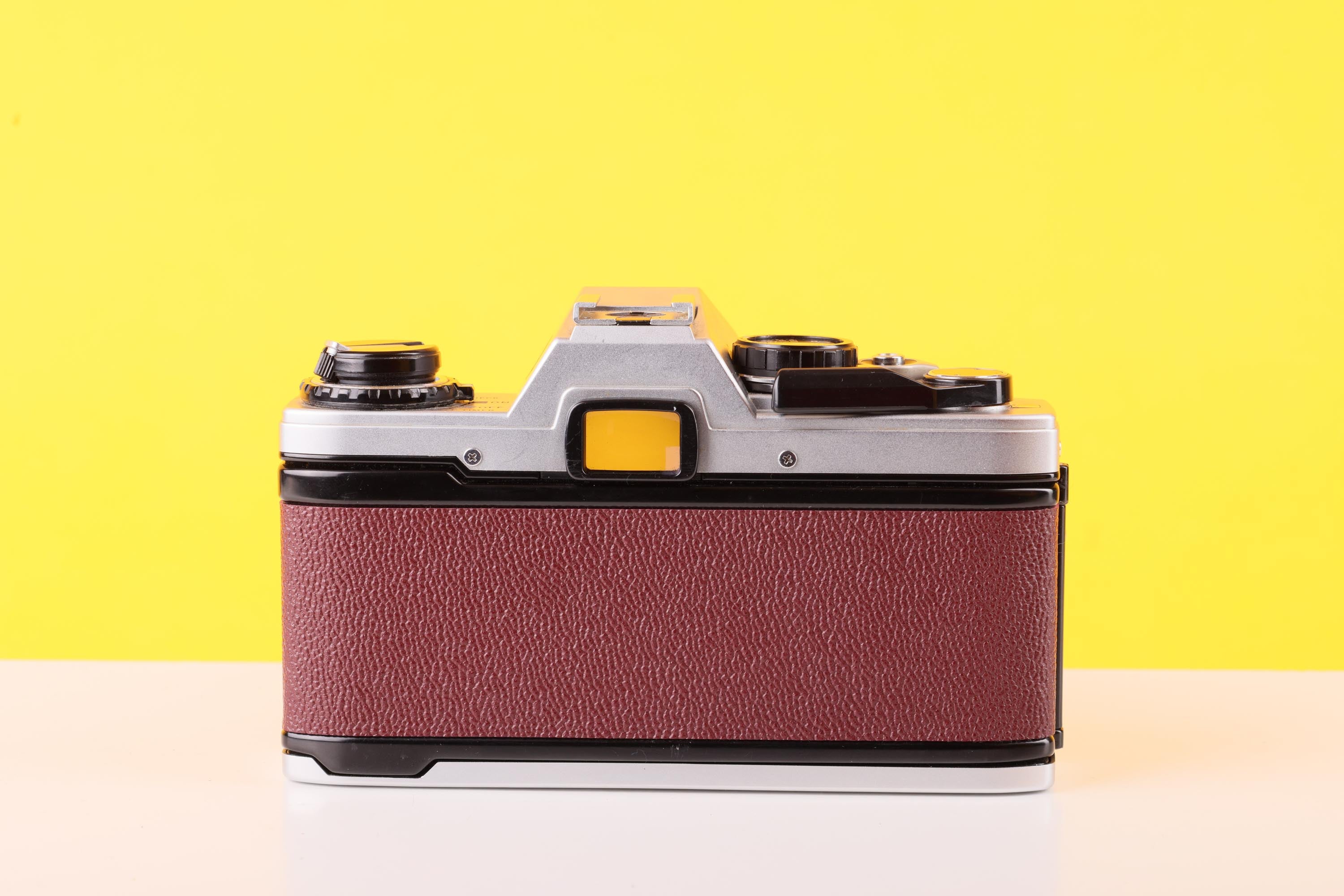 Olympus OM10 35mm Film Camera with Zuiko 50mm f1.8 Prime Lens Burgundy