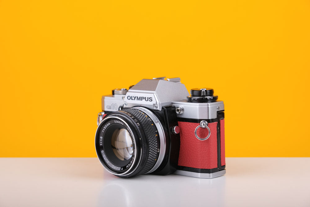 Olympus OM10 35mm Film Camera with Zuiko 50mm f1.8 Prime Lens Red Leather Skin