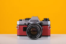 Load image into Gallery viewer, Olympus OM10 35mm Film Camera with Zuiko 50mm f1.8 Prime Lens Red Leather Skin
