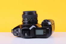 Load image into Gallery viewer, Canon T90 35mm Film Camera with Canon 28mm f/2.8 Lens
