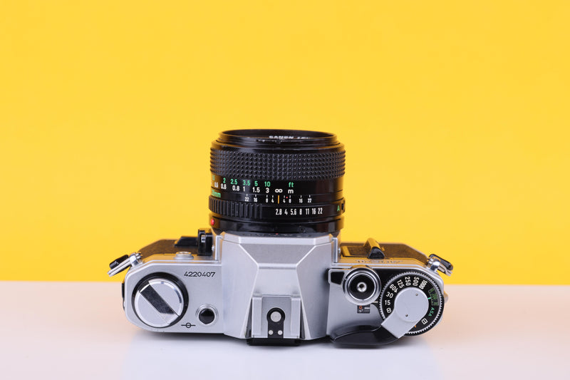 Canon AE-1 35mm SLR Film Camera with Canon 28mm f/2.8 Lens