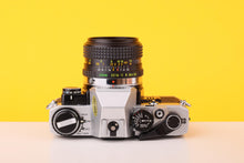 Load image into Gallery viewer, Olympus OM10 35mm Film Camera with  28mm f2.8 MC Lens with Manual Adapter
