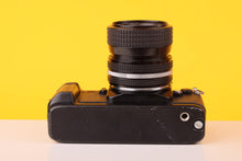 Load image into Gallery viewer, Nikon F-301 35mm SLR Film Camera with Nikkor 35-70mm f3.3-4.5 Lens
